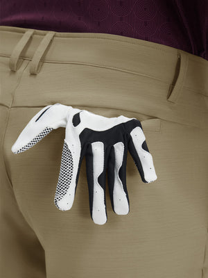 Detail view of back pocket on khaki flat front hybrid golf shorts