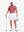 Front full body shot of model wearing brick red dry fit waffle textured collared golf shirts