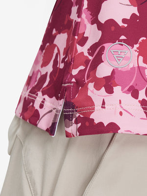 Detail view of hem on red splatter women's sleeveless v-neck print golf shirts