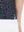 Detail view of hem on black gray blocks women's sleeveless v-neck print golf shirts