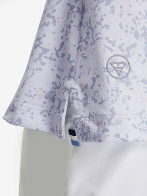 Detail view of hem on pink purple rose women's sleeveless v-neck print golf shirts