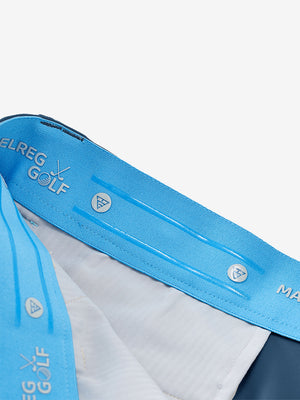 Inside waistband detail of water-resistant golf stretch nylon pants featuring maelreg logo, blue indigo.