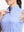 Detail view of neck zipper on white blue stripes women's sleeveless q-zip print quick dry golf tops