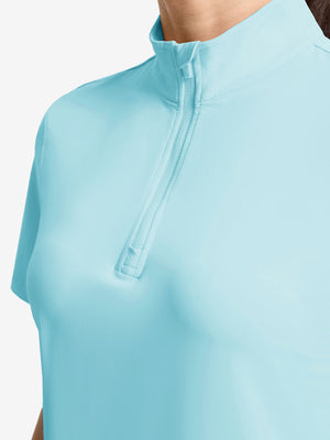 Detail view of neck zipper on light blue women's breathable 1/4 zip pullover golf shirts