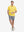 Full-body view of model holding takeaway drink cup in yellow cotton blend plain shirt.