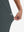 View showing loose fit of dark grey women's high waist stretch golf pants with pockets