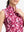 Detail view of neck zipper on red splatter women's sleeveless q-zip print quick dry golf tops