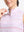Detail view of neck zipper on pink purple stripes women's sleeveless q-zip print quick dry golf tops