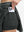 Detail view of inner pocket on dark grey women's moisture-wicking athletic tennis skirts