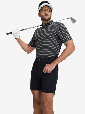 Front full body shot of model exercising in stretch limo/ltgrey heather non-curl ribbed collar striped polo shirts