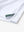 Hem slit detail of WHITE Moisture Wicking Color Block Polo Shirt highlighting stitching and finish.