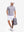 Front full body shot of model wearing light purple white comfy breathable pin-stripe texture golf polos