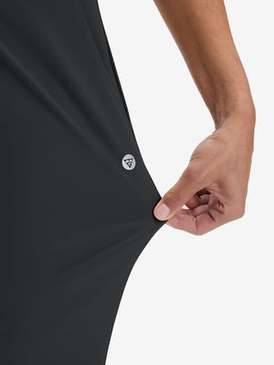 View showing loose fit of black women's high waist stretch golf pants with pockets