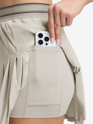 Detail view of inner pocket on oyster gray women's moisture-wicking athletic tennis skirts