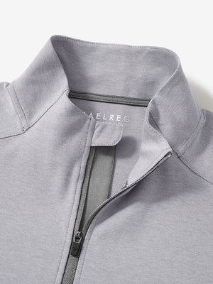 Close-up collar detail of light grey two tone pique cotton blend q-zip with subtle logo