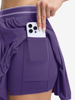 Detail view of inner pocket on dark purple women's moisture-wicking athletic tennis skirts