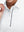 Detail view of cuff on white women's 4 buttons golf polo shirts