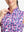 Detail view of neck zipper on rose red florals women's sleeveless q-zip print quick dry golf tops