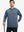 Model with one hand in pocket, wearing classic heather pullover hoodie in navy melange, relaxed look.