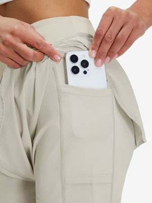 Detail view of side pocket on oyster gray women's gym golf shorts with liner pocket