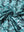 Texture detail of Performance jersey print polo with soft stretch in dark green leaf