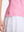 Detail view of hem on pink white florals women's sleeveless q-zip print quick dry golf tops