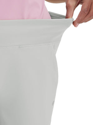 Detail view of waist stretch on silver gray women's high waist stretch golf pants with pockets