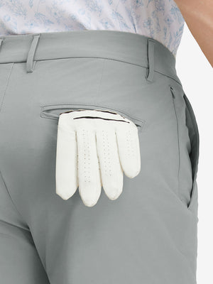 Detail view of back pocket on rose dust stretch cotton blend slim fit golf trousers 5 pockets