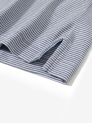 Detail view of hem on navy white comfy breathable pin-stripe texture golf polos