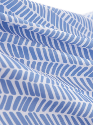 Close-up texture of white blue stripes women's sleeveless v-neck print golf shirts fabric showing printed weave detail.