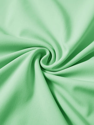Fabric detail of youth long sleeve hoodied with kangaroo pocket, soft knit texture with light green tone