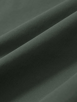 Close-up of grey green stretch quick dry casual golf pants with 4 pockets fabric texture.