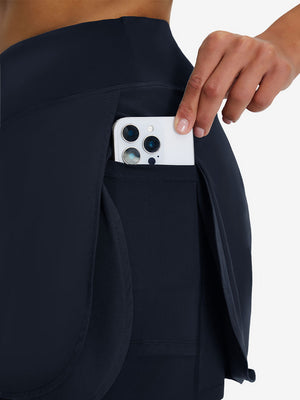 Detail view of side pocket on navy blue women's gym golf shorts with liner pocket