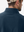 Close-up view of the logo on the back of the navy pullover