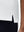 Detail view of hem on white women's 4 buttons golf polo shirts
