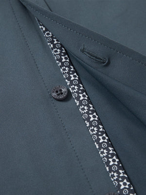 Detail view of buttons on dark grey cool print plain button up shirts