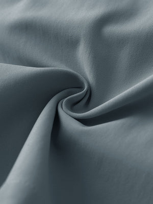 Close-up fabric detail of 4-way stretch performance solid shorts, smooth texture with flexible dark grey feel