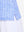 Detail view of hem on white blue stripes women's sleeveless q-zip print quick dry golf tops