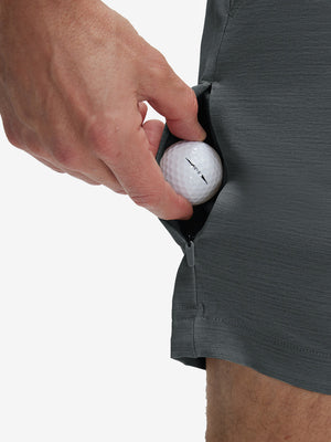 Detail view of stretch fabric on iron grey flat front hybrid golf shorts