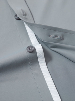 Detail view of buttons on grey cool print plain button up shirts