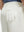 Detail view of back pocket on white flat front flex cotton blend golf shorts