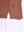 Hem detail close-up in red ochre heather of performance heather contrast collar polo shirts.