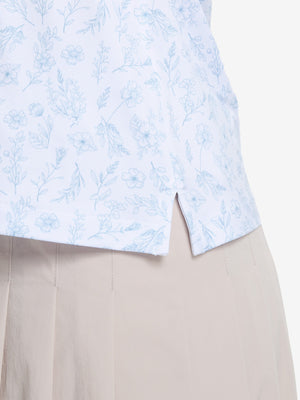 Detail view of hem on white blue florals women's sleeveless q-zip print quick dry golf tops