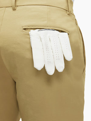 Detail view of back pocket on khaki flat front flex cotton blend golf shorts