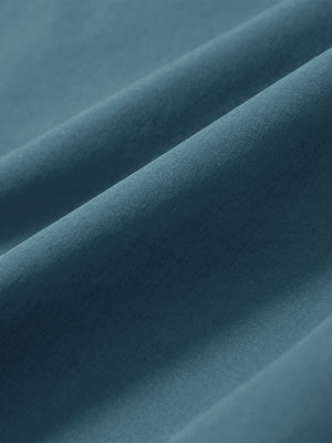 Close-up of blue stretch quick dry casual golf pants with 4 pockets fabric texture.