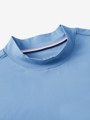 Detail view of mock neck on light blue women's moisture-wicking mock neck sleeveless golf tops
