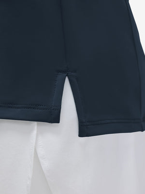 Detail view of hem on navy  women's 4 buttons golf polo shirts