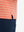 Detail view of hem on peach amber/calypso coral non-curl ribbed collar striped polo shirts