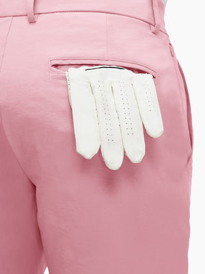 Detail view of back pocket on pink flat front flex cotton blend golf shorts