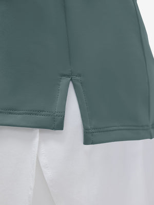 Detail view of hem on dusty blue women's 4 buttons golf polo shirts